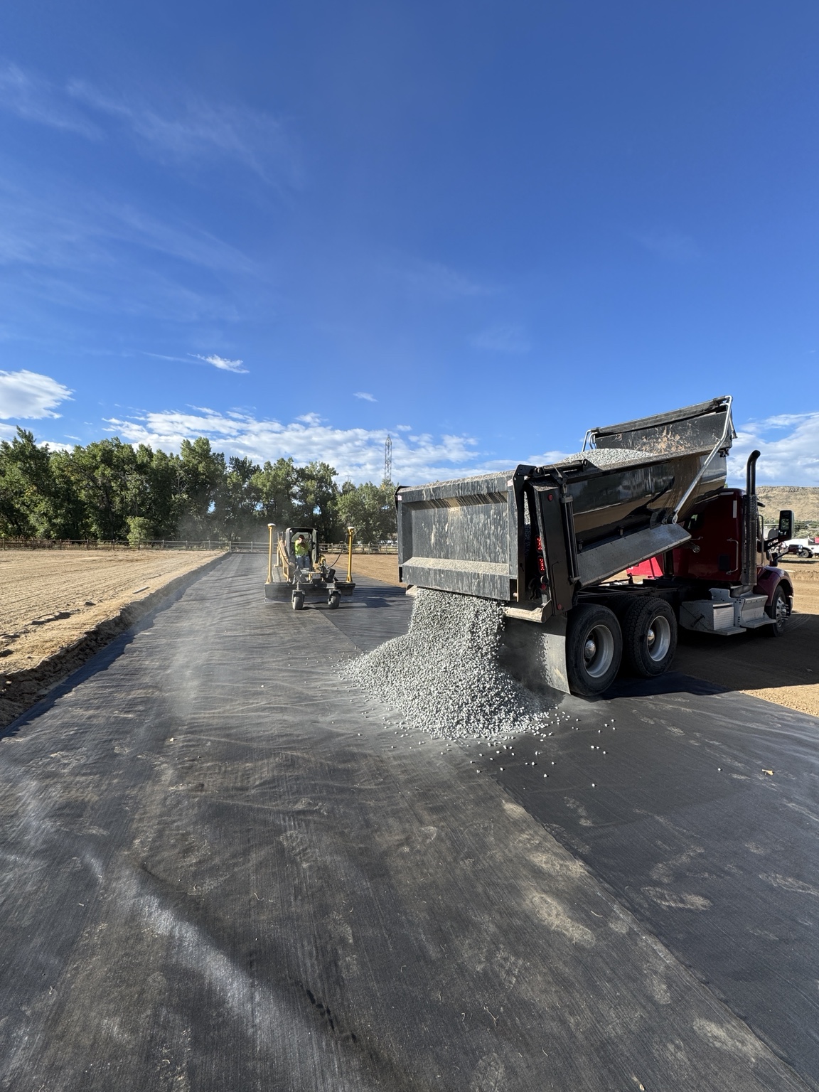 Gravel placement behind a dump truck