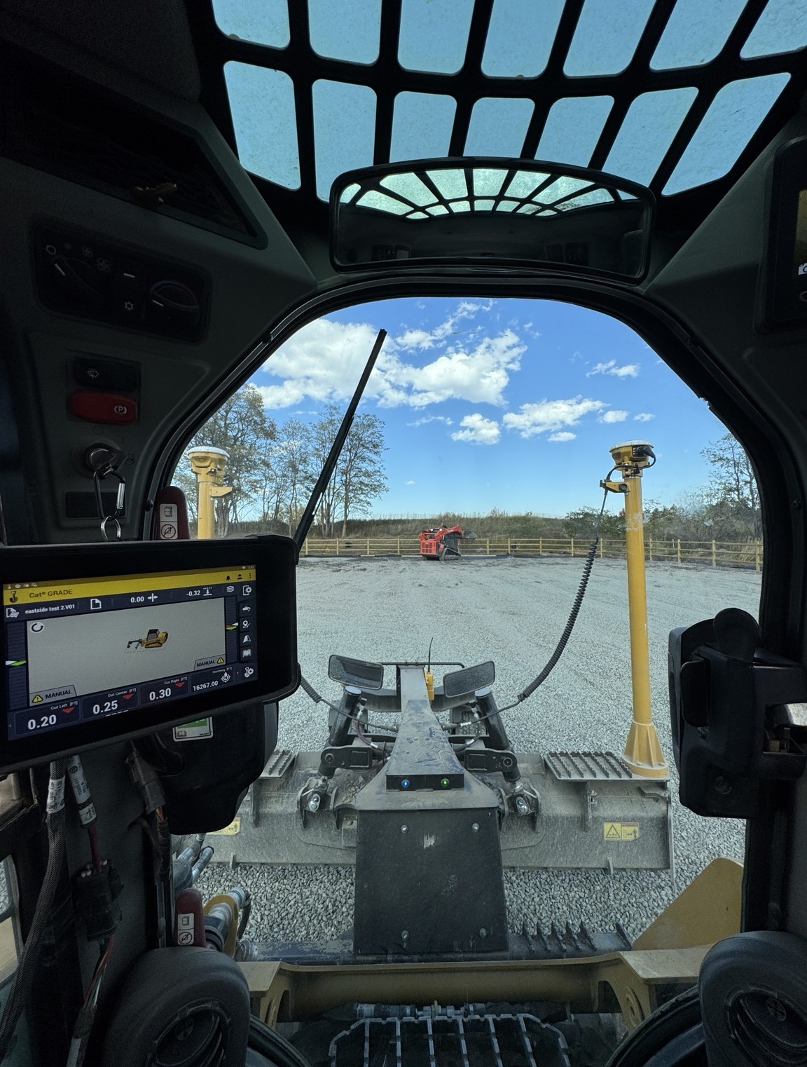 Inside a Komatsu dozer cab with a Trimble machine control display